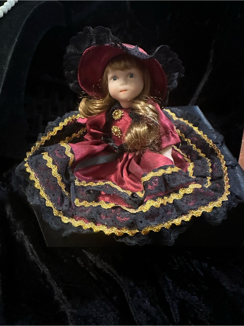 Porcelain Collectible Doll in Burgundy and Black - Picture 4 of 9